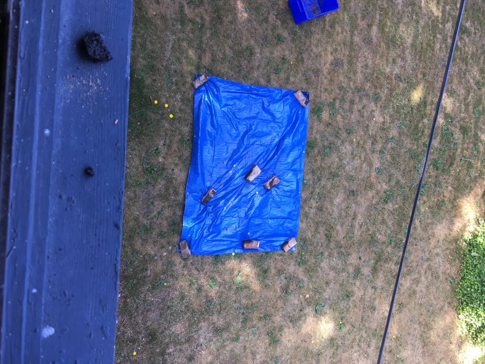 Bricks tossed onto a tarp